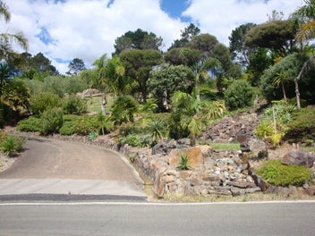 ALMOST ¾ ACRE IN A PARK LIKE SETTING